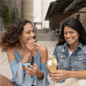 Two women injoying ice cream.