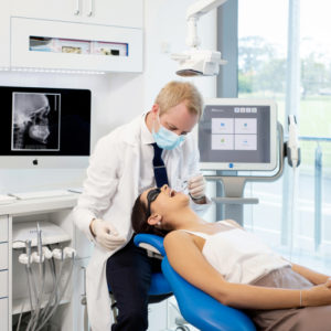 Daniel O'Connor conducting a check-up on his patient.