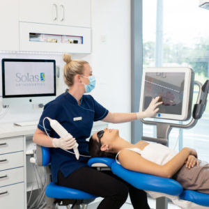 A nurse administering treatment to her patient.